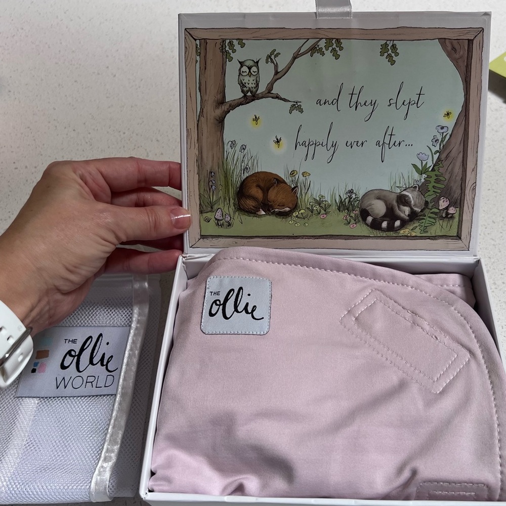 Ollie swaddle- lavender color, Like new.
